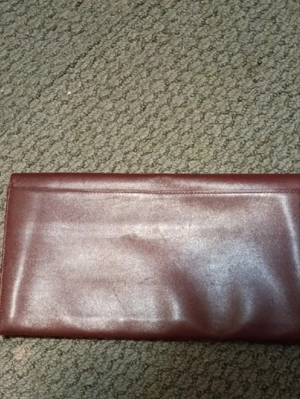 Cartier- Leather Fold-Over Clutch in Burgundy with Gold Accents
